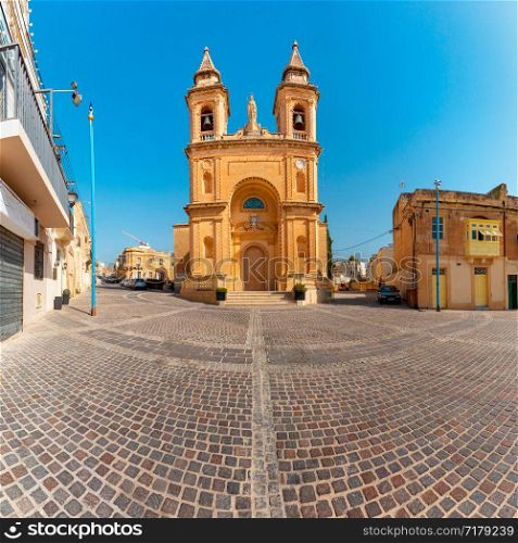 Parish Church of Our Lady of Pompei in the Harbor of Mediterranean fishing village Marsaxlokk, Malta. Church of Our Lady in Marsaxlokk, Malta