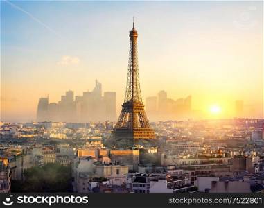 Parisian cityscape with the view on Eiffel Tower at sunset, France. Eiffel Tower and La Defense