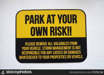 Park at your own risk sign on wall