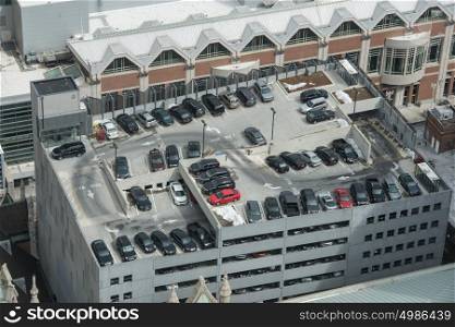 Parking garage full of cars in the big city. Parking concept. View from the top.