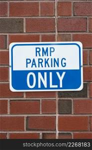 parking sign brick wall closeup