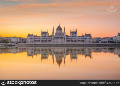 Parliament building over delta of Danube river in Budapest, Hungary at sunset