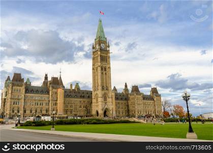 Parliament Hill in Ottawa, Canada. Facade view of Centre Block of Canadian Parliamentary complex in autumn