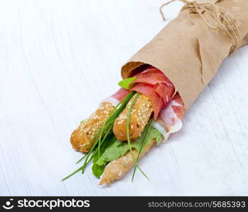 Parma ham prosciutto with grissini bread sticks