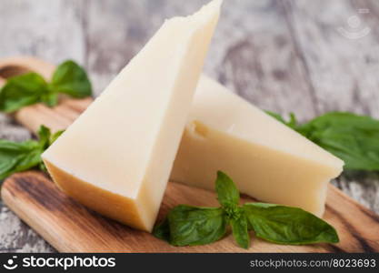 parmesan cheese. parmesan cheese on wooden background