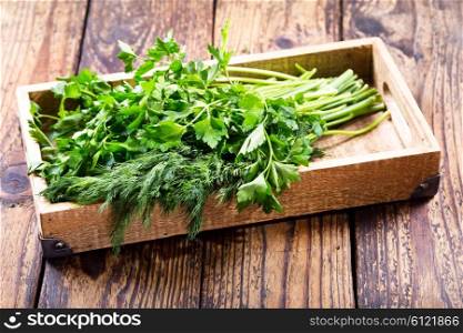 parsley and dill in a wooden box