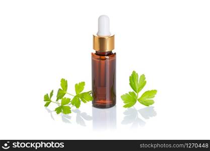 Parsley essential oil isolated on white background. Parsley oil for skin care, spa, wellness, massage, aromatherapy and natural medicine