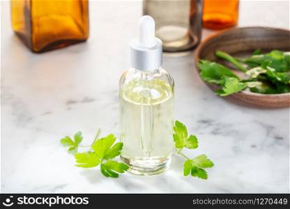 Parsley essential oil. Parsley oil for skin care, spa, wellness, massage, aromatherapy and natural medicine
