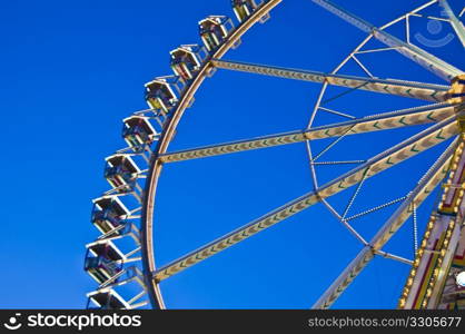 part of a ferris wheel on a beautiful day