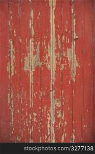 Part of a old woodboard texture painted on red.