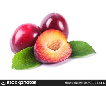 Part of a purple plum with leaves isolated
