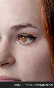 Part of a red haired female face.