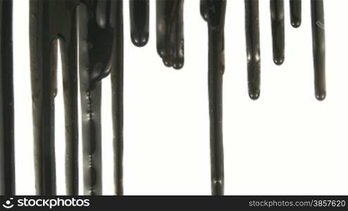 Part of a series. Black liquid dripping down over a white background