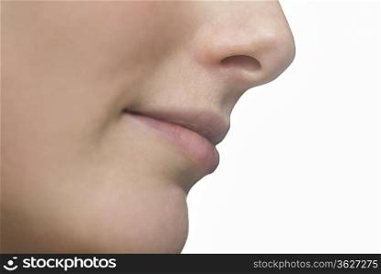 Part of a young womans face showing her lips and nose