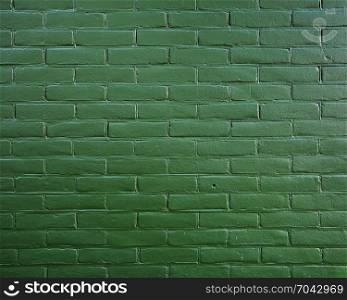 part of abstract pattern on dark green painted brick wall