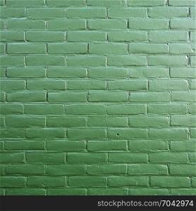 part of abstract pattern on dark green painted brick wall