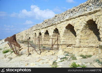 Part of ancient aqueduct on the beach near Caesarea, Israel