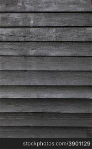 part of black wooden fence or part of black painted barn