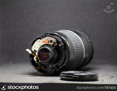 part of camera lens isolated on black background broken camera. part of camera lens isolated on black background broken