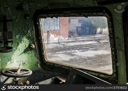 Part of control cabin of abandoned and crumbling railcar