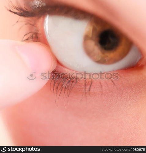 Part of face female eyes. Medicine healthcare human eye pain foreign body.