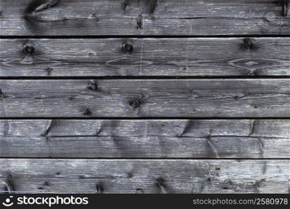 part of old black and grey wooden barn wall