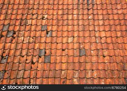 part of roof with old orange roof tiles