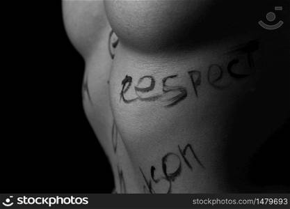 part of the body of a young girl with the inscription respect . the captions are written in the photographer&rsquo;s hand, not in a tattoo . black and white photo