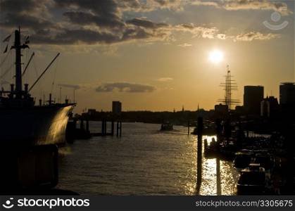 part of the harbor in Hamburg at sunset. old beautiful harbor of Hamburg at sunset