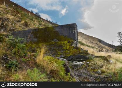 Part of the Nant-y-Gro Dam. Destroyed by explosives by Barnes Wallis. Led to RAF 617 Squadron using bouncing bombs in the Dam busters raids. Elan Valley, Powys, Wales, United Kingdom, Europe.