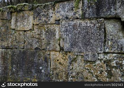 Part of the stone fence with ancient ritual stones and frescoes in Demir Baba Teke, cult monument honored by both Christians and Muslims in winter near Sveshtari village, Isperih, Razgrad, Northeastern Bulgaria
