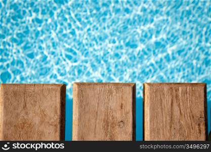 Part of the wooden bridge over the swimming pool. Summer background