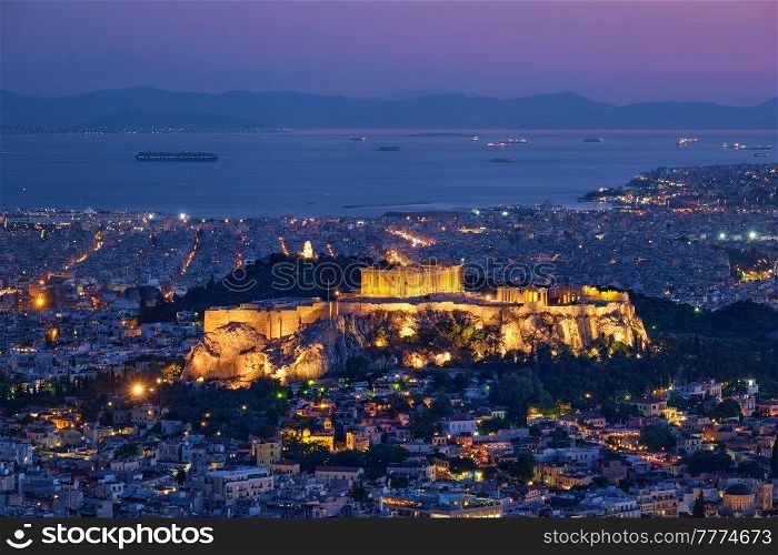 Parthenon Temple on hill is the antique tourist landmark at the Acropolis of Athens and ancient European civilization architecture on Aegean sea coast. Dusk view from Mount Lycabettus, Athens, Greece. Iconic Parthenon Temple at the Acropolis of Athens, Greece