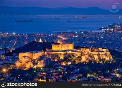 Parthenon Temple on hill is the antique tourist landmark at the Acropolis of Athens and ancient European civilization architecture on Aegean sea coast. Dusk view from Mount Lycabettus, Athens, Greece. Iconic Parthenon Temple at the Acropolis of Athens, Greece