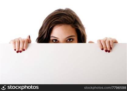 Partial face of beautiful young caucasian brunette business student woman holding a white blank board, isolated