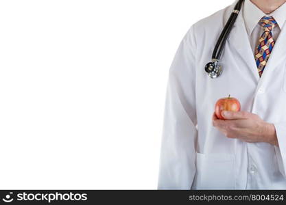 Partial front view of doctor holding apple in hand while wearing jacket with stethoscope on white background.