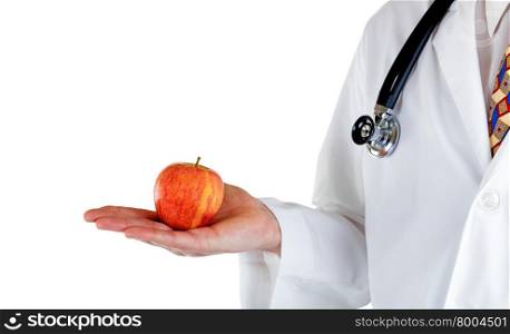 Partial side view of doctor holding apple in hand while wearing jacket with stethoscope on white background.