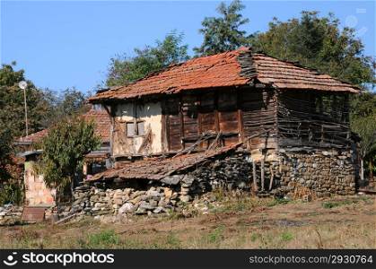 Partially damaged house in the Bulgarian village in the fall
