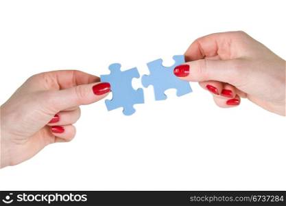 partnership concept. two hands with different pieces of puzzle