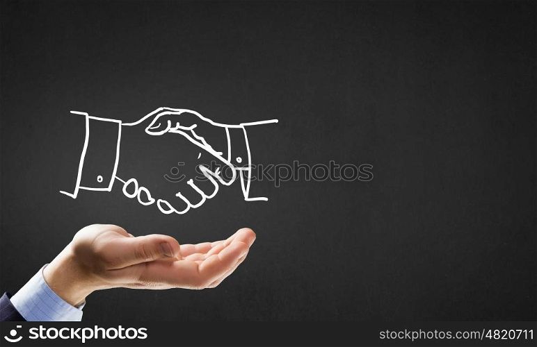 Partneship sketch handshake. Human hand and sketch of handshake on gray background
