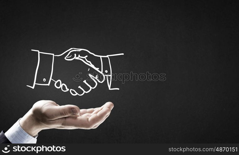 Partneship sketch handshake. Human hand and sketch of handshake on gray background
