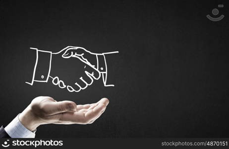 Partneship sketch handshake. Human hand and sketch of handshake on gray background