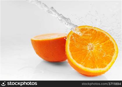 Parts of bright oranges and water splashes