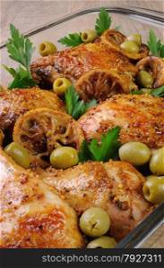 parts of chicken baked with olives marinated in lemon