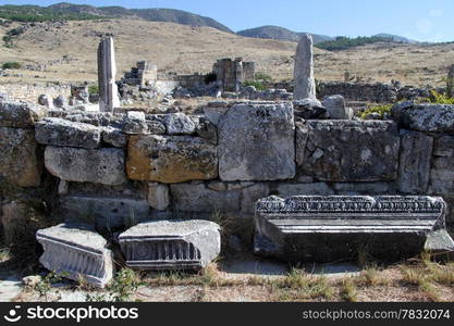 Parts of stone facade and ruins in Hyerapolis, Turkey