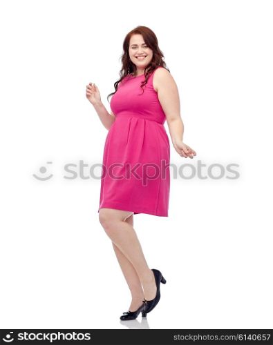party and people concept - smiling happy young plus size woman posing in pink dress dancing. happy young plus size woman dancing in pink dress