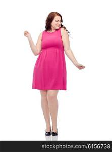 party and people concept - smiling happy young plus size woman posing in pink dress dancing. happy young plus size woman dancing in pink dress