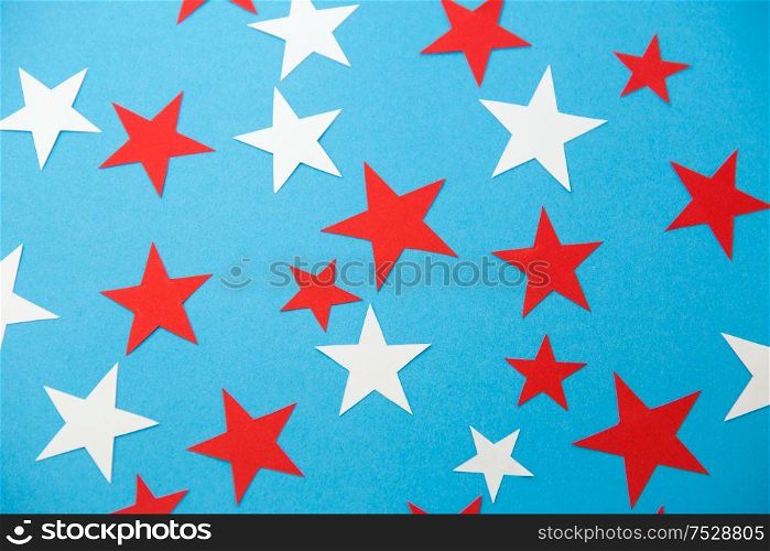 party, celebration and decoration concept - star shaped confetti on blue background. star shaped confetti decoration on blue background