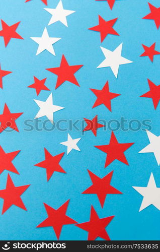 party, celebration and decoration concept - star shaped confetti on blue background. star shaped confetti decoration on blue background