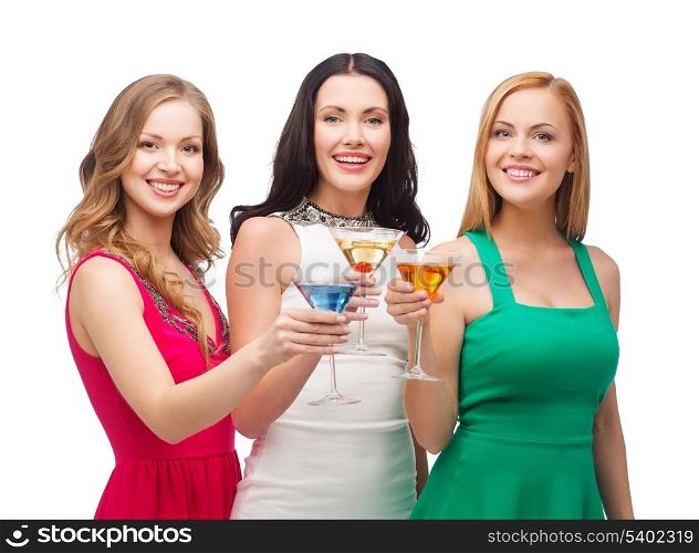party, celebration, friends, bachelorette party, birthday concept - three beautiful women in evening dresses with cocktails